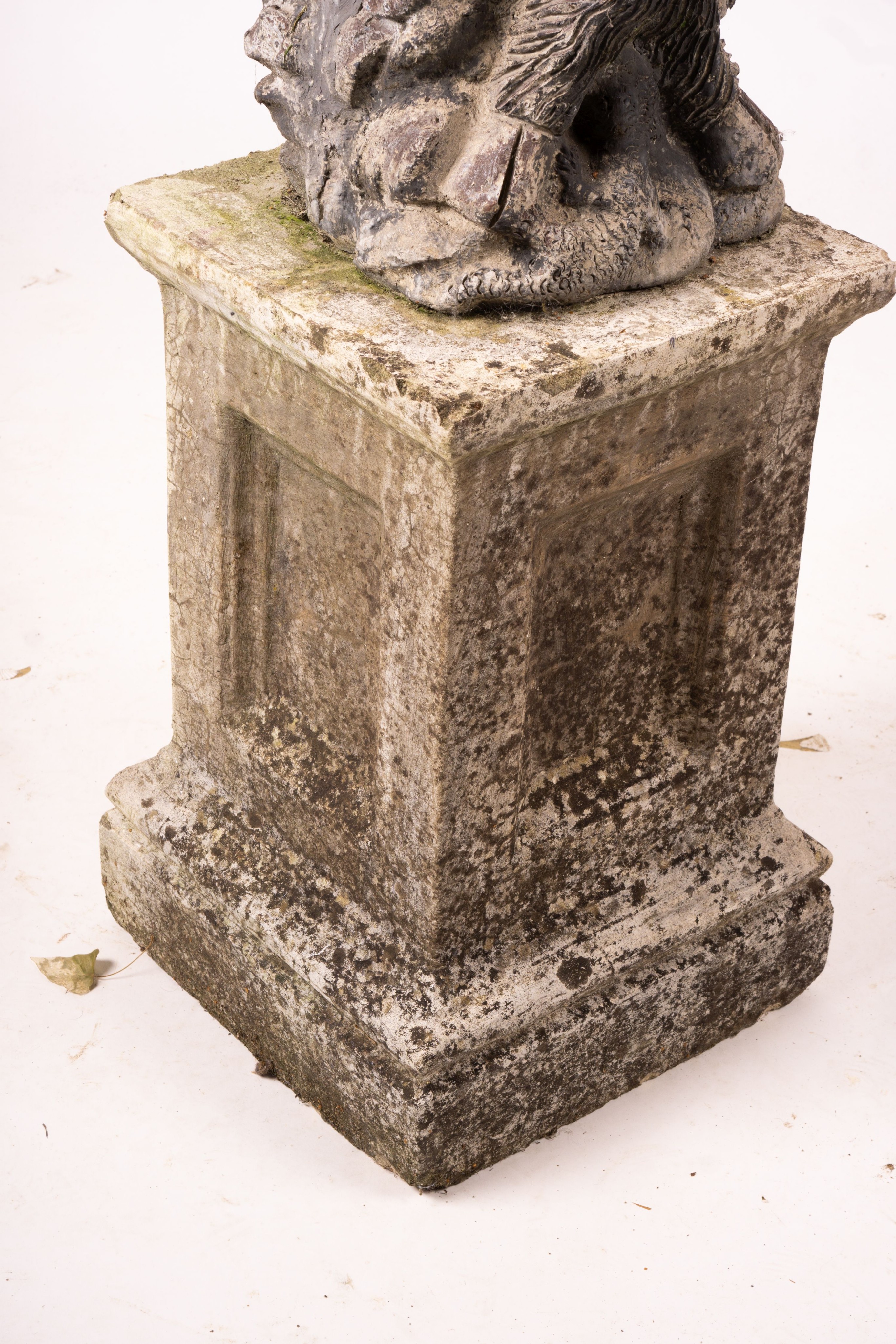 A cast lead figure, seated pan, on reconstituted concrete base, total height 107cm